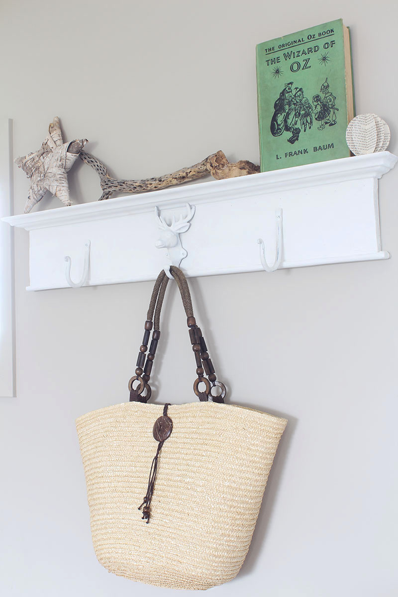 Want to create a unique place to hang your stuff? Grab an antique header, throw on some metal hooks and you've got yourself a DIY wall mounted coat rack!
