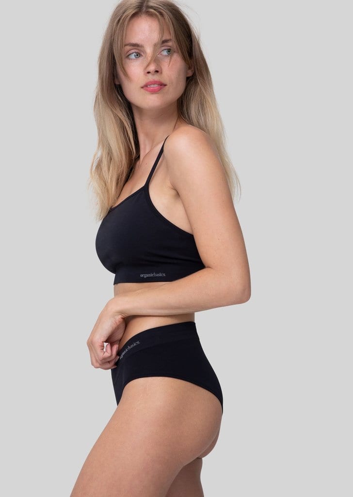 Want to create an eco-friendly laundry practice? Cut down on water use by washing your clothes less often - and invest in high-quality clothing basics. Like these anti-microbial hipster briefs and sports bra by Organic Basics.