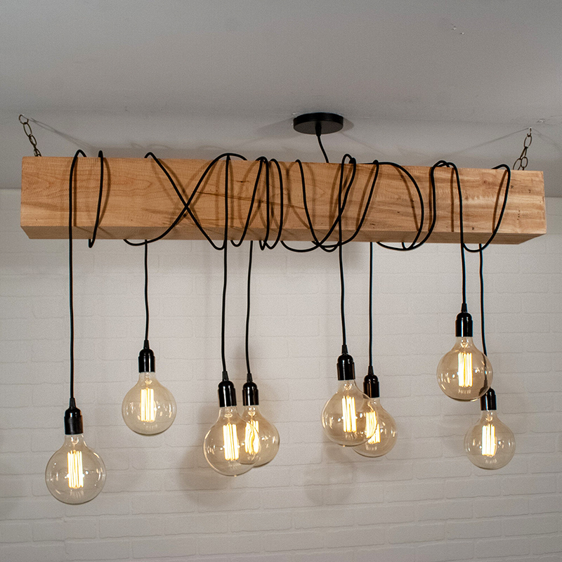 Looking for modern farmhouse light fixtures? Well, these five beauties are the real deal as they were all handmade! Like this wooden beam chandelier by LoewenDesignStudios.