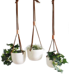 Love the look of bohemian bedroom decor, but need a little guidance pulling it all together? Check out this boho bedroom shopping guide - featuring eco-conscious items like these handmade porcelain hanging planters from ethical marketplace Made Trade.