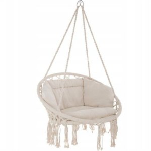 Here's how to create a modern boho living room, which balances the funky boho vibe with clean lines and neutral colours - and features beautiful furniture like this hanging chair.