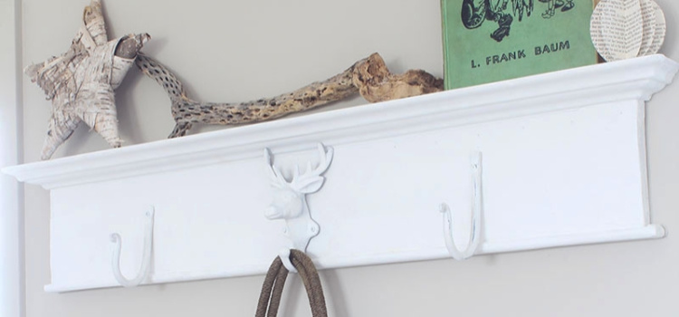 Want to create a unique place to hang your stuff? Grab an antique header, throw on some metal hooks and you've got yourself a DIY wall mounted coat rack!Want to create a unique place to hang your stuff? Grab an antique header, throw on some metal hooks and you've got yourself a DIY wall mounted coat rack!