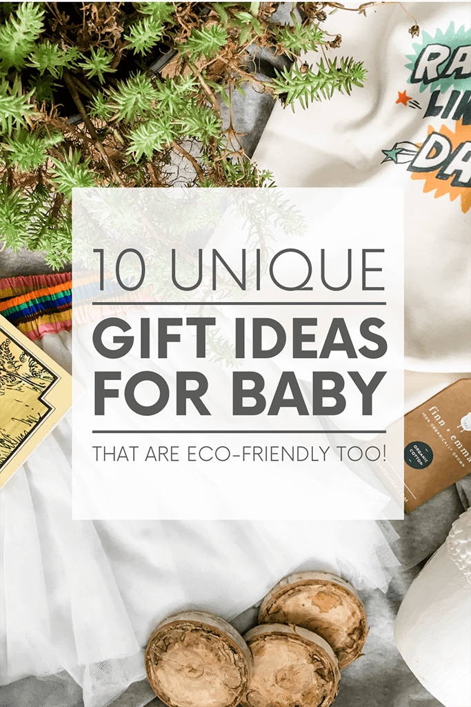 Various baby items on a grey background along with a plant and the words 