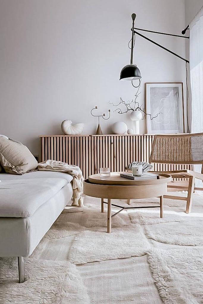 A bright Japandi living room with light wooden furniture and nature-inspired accessories.