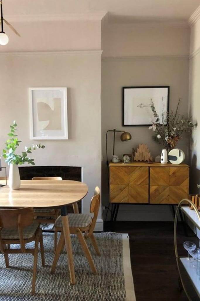 A dining room with wood and brass accents.