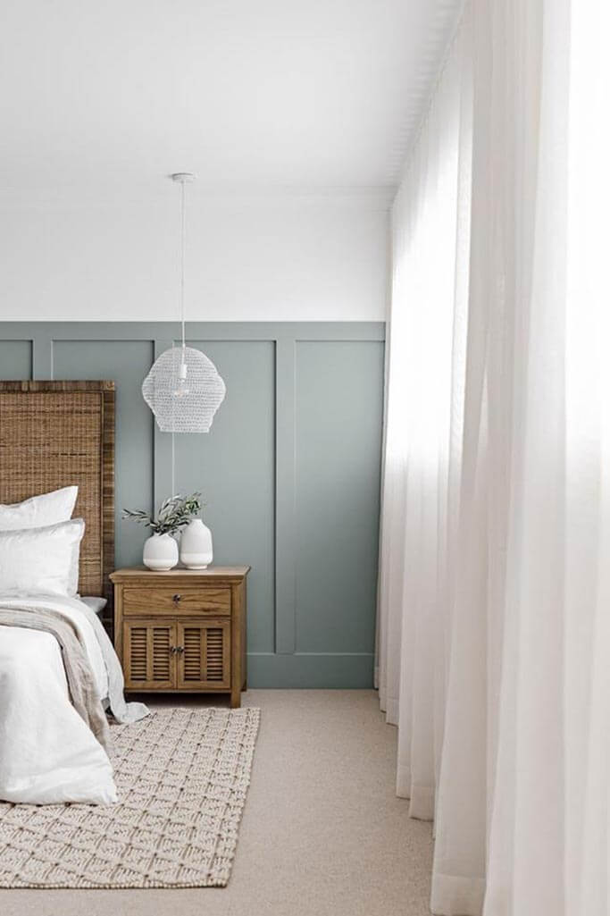 A bedroom with coastal decor.