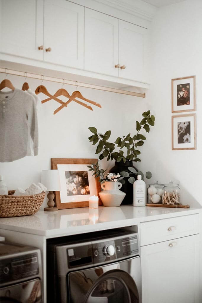 A beautiful laundry room with a grey washer and dryer.
