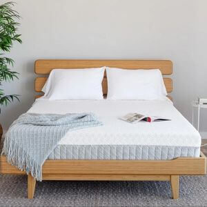 A bed with a memory foam mattress.