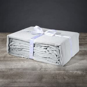A folded sheet set tied with a ribbon.