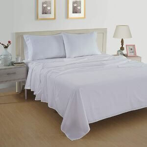 A pretty bedroom with light purple sheets.