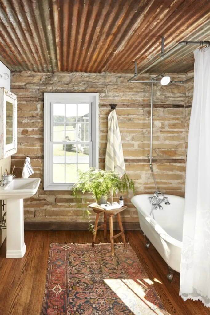 A rustic bathroom filled with reclaimed building materials.