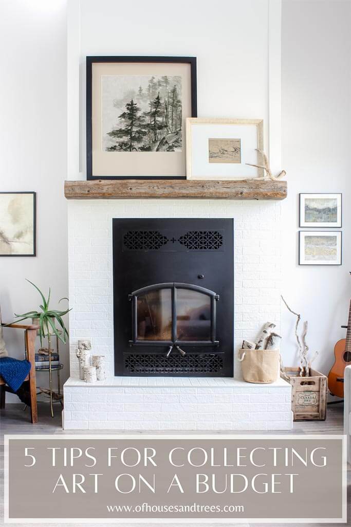 A bright living room with a fireplace and various pieces of neutral coloured art and text 5 tips for collecting art on a budget.