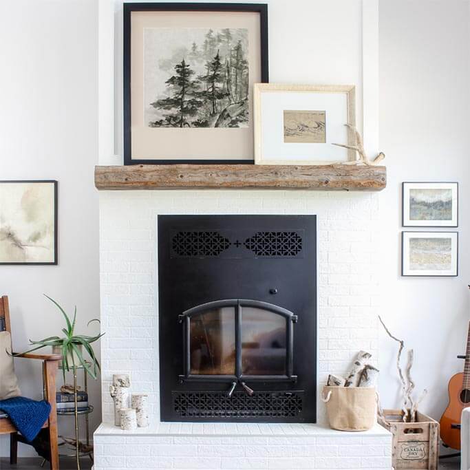 A living room with neutral coloured art and text 5 tips for collecting art on a budget.