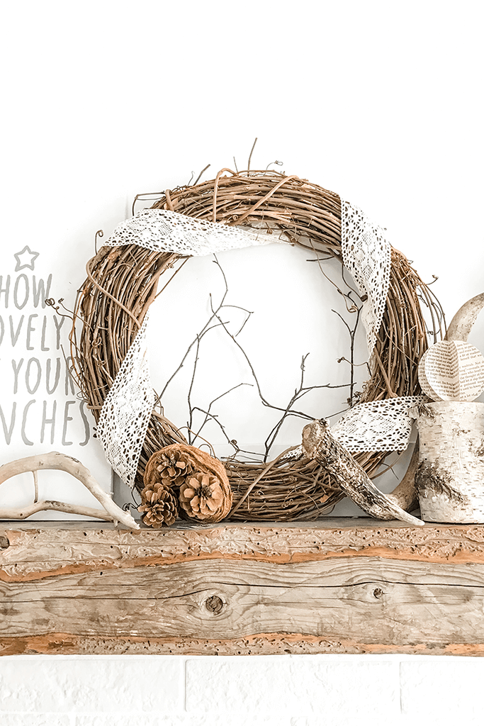 Holiday wreath made of twigs and wrapped in lace.