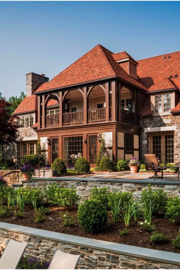 A large home with a red tile roof.