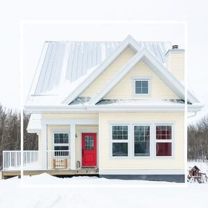 A yellow house in winter.