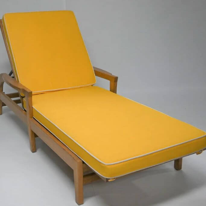 Wooden outdoor lounge chair with a mustard yellow cushion.